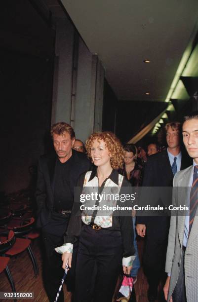 Laeticia Hallyday, her husband Johnny Hallyday, and Laura Smet arriving at the fashion show, Paris, 19th October 1997