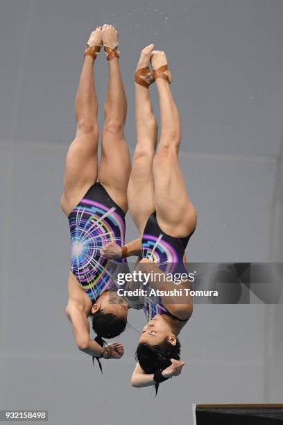 Jun Hoong Cheong and Pandelela Pamg of Malaysia compete in the Women's 10m Synchro Platform final during day one of the FINA Diving World Series Fuji...