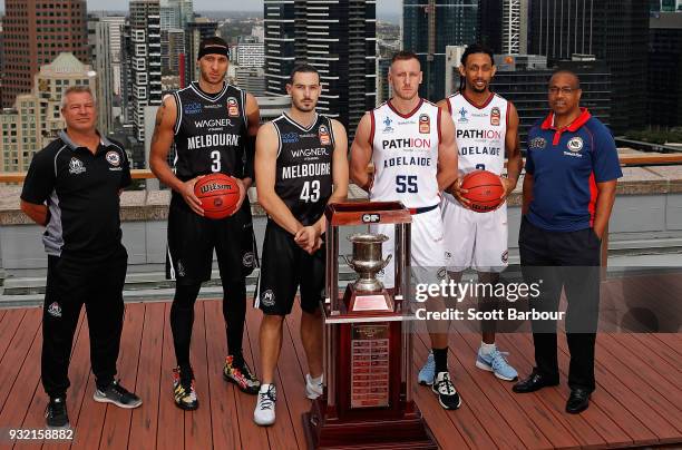 Coach Dean Vickerman, Josh Boone and Chris Goulding of Melbourne United along with Mitch Creek, Josh Childress and coach Joey Wright of the Adelaide...