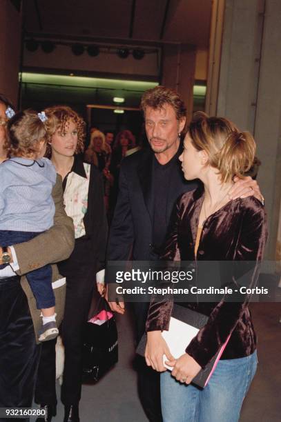 Laeticia Hallyday arriving at the fashion show with her sister Margaux Thibaut, her husband Johnny Hallyday and his daughter Laura Smet, Paris, 19th...