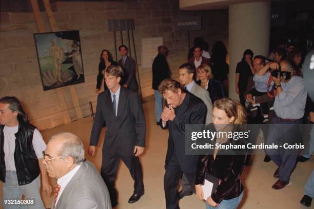 Johnny Hallyday with his daughter Laura Smet and his wife's family arriving at the fashion show. Laeticia Hallyday's mother, Françoise Thibaut, her...