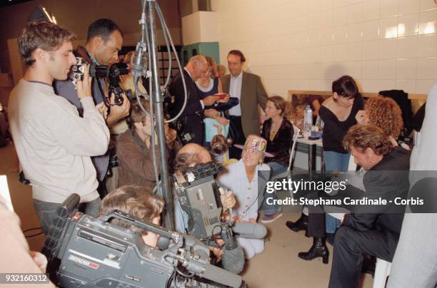 Laeticia Hallyday backstage with her mother Françoise Thibaut, her step-father, her sister Margaux Thibaut, her husband Johnny Hallyday and her step-...