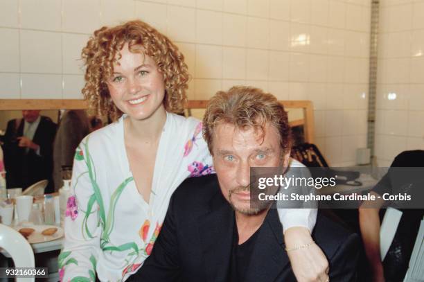 Laeticia Hallyday and her husband Johnny Hallyday posing backstage, Paris, 19th October 1997