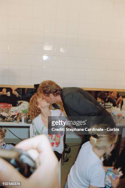 Laeticia Hallyday and her husband Johnny Hallyday kissing backstage, Paris, 19th October 1997