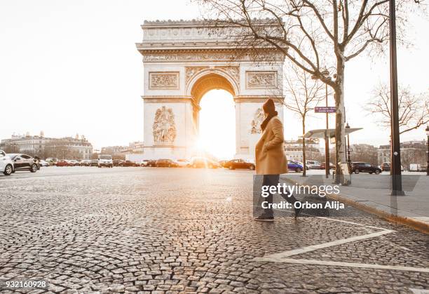 man walking in front of arc de triomphe - before they were famous stock pictures, royalty-free photos & images