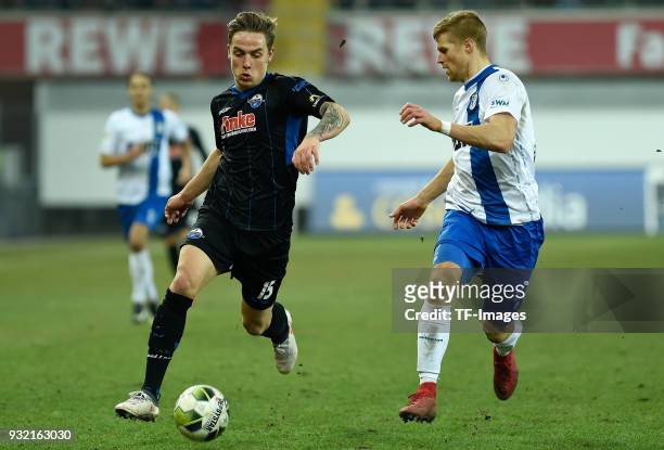 Phillip Tietz of Paderborn and Andre Hainault of Magdeburg battle for the ball during the 3. Liga match between SC Paderborn 07 and 1. FC Magdeburg...