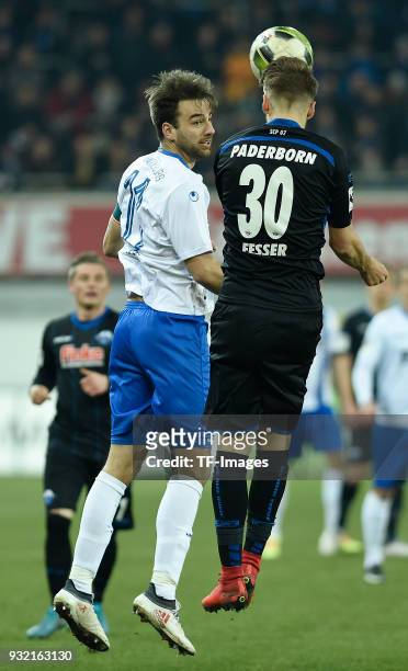 Christian Beck of Magdeburg and Leon Fesser of Paderborn battle for the ball during the 3. Liga match between SC Paderborn 07 and 1. FC Magdeburg at...