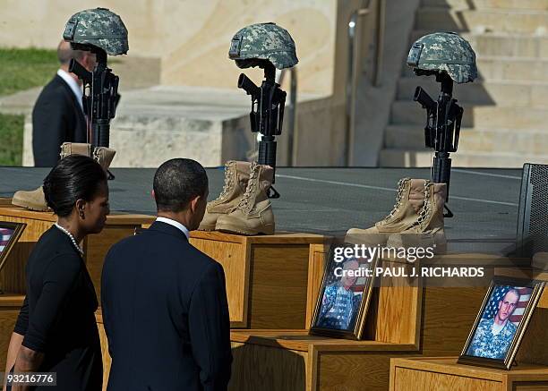 President Barack Obama and his wife Michelle view the Fallen Soldier Memorial at Fort Hood on November 10, 2009 during a ceremony honoring the 13...
