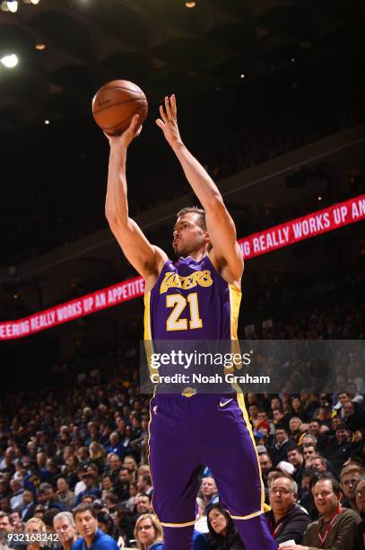 Travis Wear of the Los Angeles Lakers handles the ball against the Golden State Warriors on March 14, 2018 at ORACLE Arena in Oakland, California....