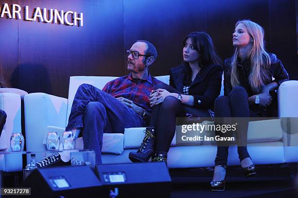 Terry Richardson, Daisy Lowe and Meloes Horst watch a presentation during the 2010 Pirelli Calendar Launch press conference at the Intercontinental...