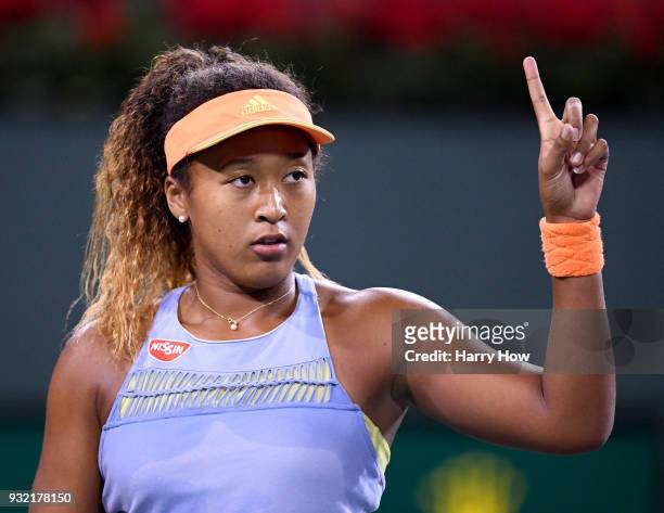 Naomi Osaka of Japan challenges a call in her match against Karolina Pliskova of the Czech Republic during the BNP Paribas Open at the Indian Wells...