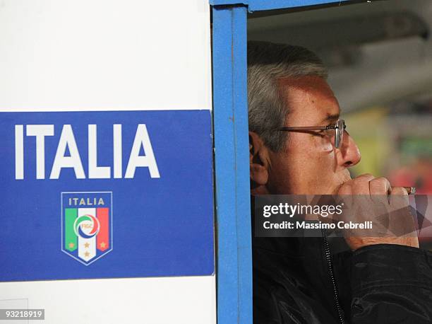 Marcello Lippi head coach of Italy smokes a cigar before the International Friendly Match between Italy and Sweden at Dino Manuzzi Stadium on...