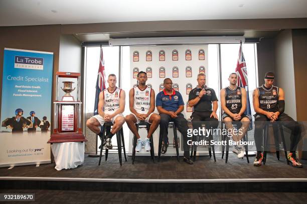 Coach Dean Vickerman, Josh Boone and Chris Goulding of Melbourne United along with Mitch Creek, Josh Childress and coach Joey Wright of the Adelaide...