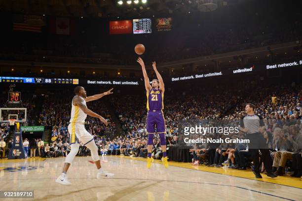 Travis Wear of the Los Angeles Lakers shoots the ball against the Golden State Warriors on March 14, 2018 at ORACLE Arena in Oakland, California....