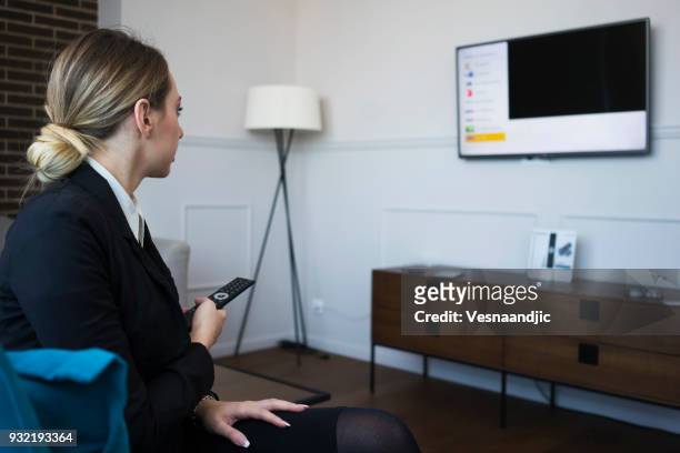 businesswoman on a business trip at the hotel room - smart tv stock pictures, royalty-free photos & images