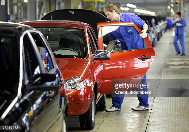 Employees assemble Lada Kalinas on the production line at AvtoVAZ factory in Togliatti, Russia, on Tuesday, Nov. 17, 2009. Russia may look for other...