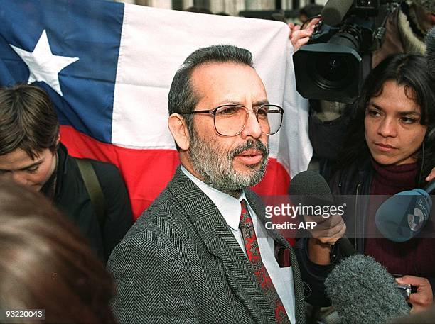 Carlos Reyes of the Chilean Democratico, talks to newsmen after attending the a court hearing presented by lawyers for former Chilean dictator...