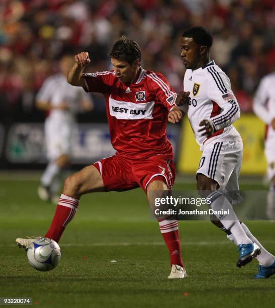 Logan Pause of the Chicago Fire controls the ball under pressure from Robbie Finley of Real Salt Lake during the MLS Eastern Conference Championship...