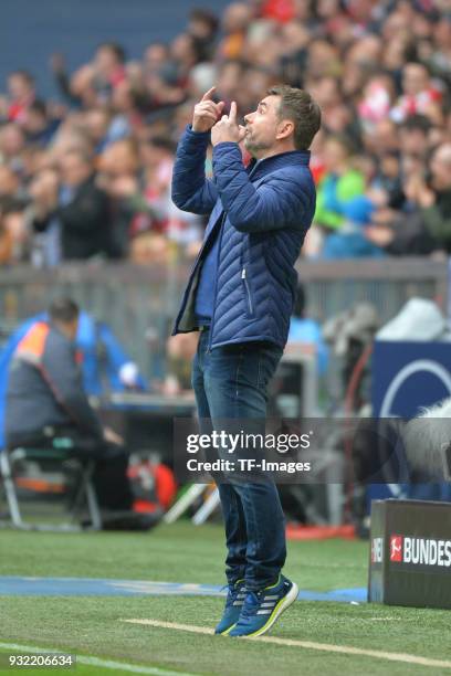 Head coach Bernd Hollerbach of Hamburg gestures during the Bundesliga match between FC Bayern Muenchen and Hamburger SV at Allianz Arena on March 10,...