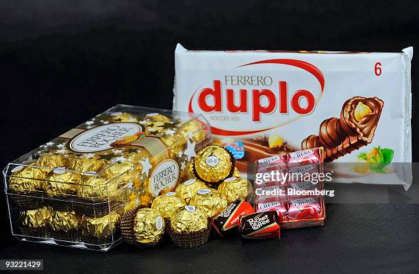 Ferrero SpA's Duplo, Fererro Rocher, Mon Cheri and Pocket Coffee chocolate products are arranged for a photograph in Milan, Italy, on Thursday, Nov....