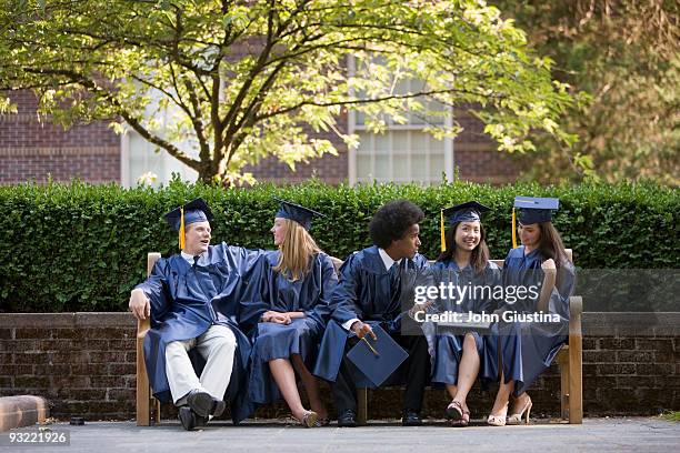 graduates relax and talk after graduation. - bank student stock-fotos und bilder