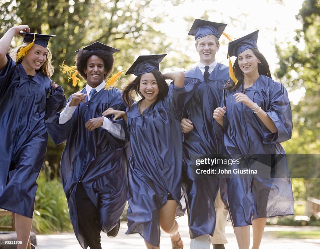 Teens celebrate graduation from High School.