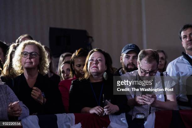 Supporters listen as Democrat candidate Conor Lamb gives his victory speech at the Hilton Garden Inn Pittsburgh-Southpointe after winning the...