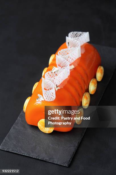 contemporary orange yule log - glaserad mat bildbanksfoton och bilder