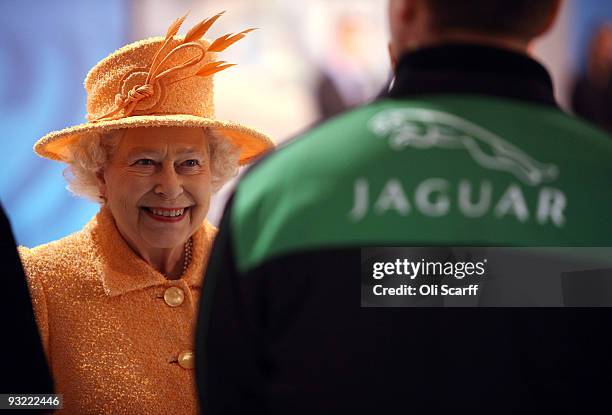 Queen Elizabeth II tours the Marshall Aerospace factory on November 19, 2009 in Cambridge, England. The privately-owned aerospace engineering company...