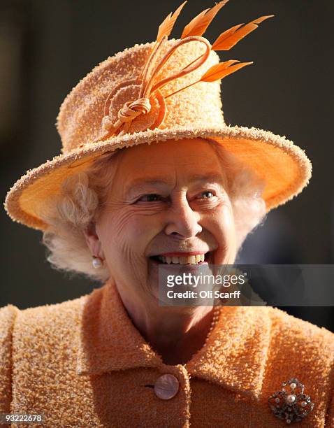 Queen Elizabeth II meets members of staff as she tours the Marshall Aerospace factory on November 19, 2009 in Cambridge, England. The privately-owned...