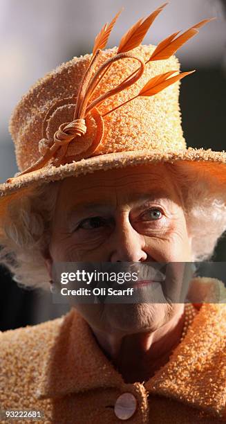 Queen Elizabeth II meets members of staff as she tours the Marshall Aerospace factory on November 19, 2009 in Cambridge, England. The privately-owned...