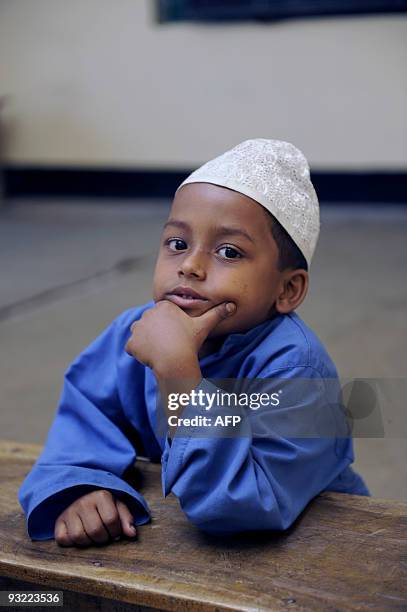 Bangladesh-unrest-religion,FOCUS by Shafiq Alam A young Madrassas or Islamic school student poses in his classroom on the outskirts of Dhaka on March...