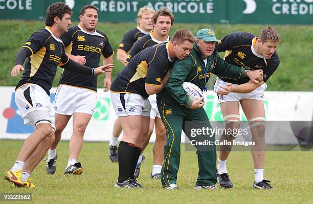 Gary Gold , John Smit and Bakkies Botha of South Africa in action during the Springboks training session at Udine rugby club on November 19, 2009 in...