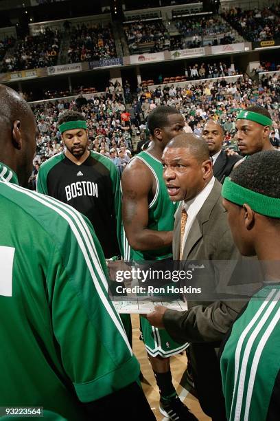 Head Coach Doc Rivers of the Boston Celtics huddles with his team during a break from the game against the Indiana Pacers on November 14, 2009 at...