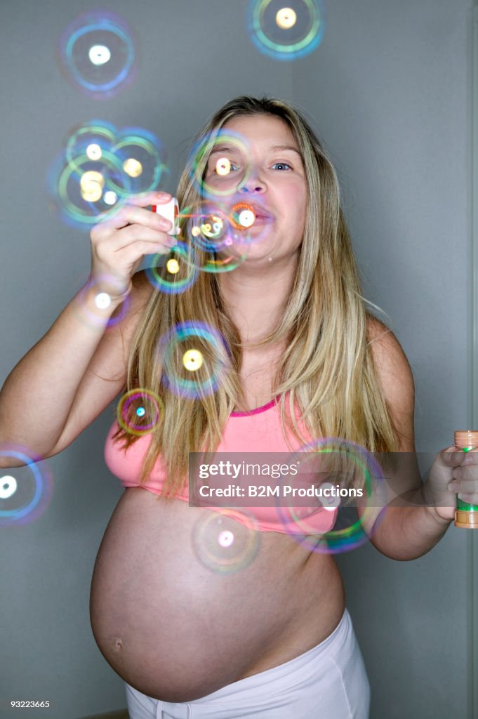 Pregnant woman Blowing Bubbles