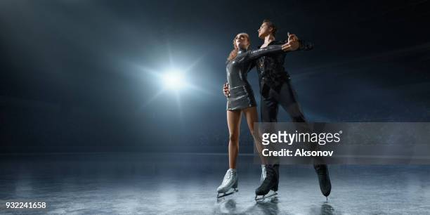 figure skating. ice skaters couple - figure skating fall stock pictures, royalty-free photos & images