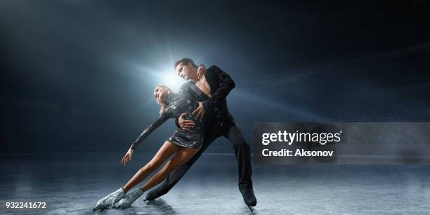 figure skating. ice skaters couple - figure skating arena stock pictures, royalty-free photos & images