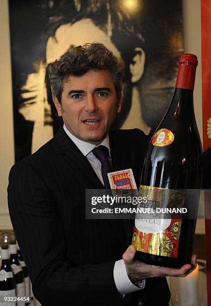 French wine manufacturer Frank Duboeuf displays a large bottle of Beaujolais Nouveau, during Beaujolais Nouveau celebrations in New York, November...