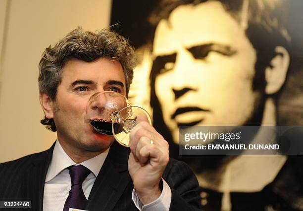 French wine manufacturer Frank Duboeuf drinks a glass of Beaujolais Nouveau, during Beaujolais Nouveau celebrations in New York, November 19, 2009....