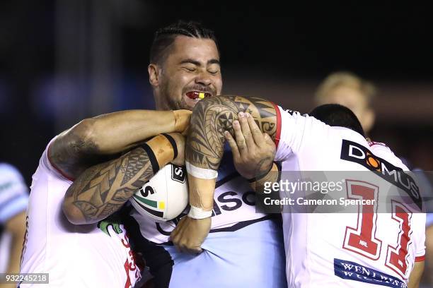 Andrew Fifita of the Sharks is tackled during the round two NRL match between the Cronulla Sharks and the St George Illawarra Dragons at Southern...