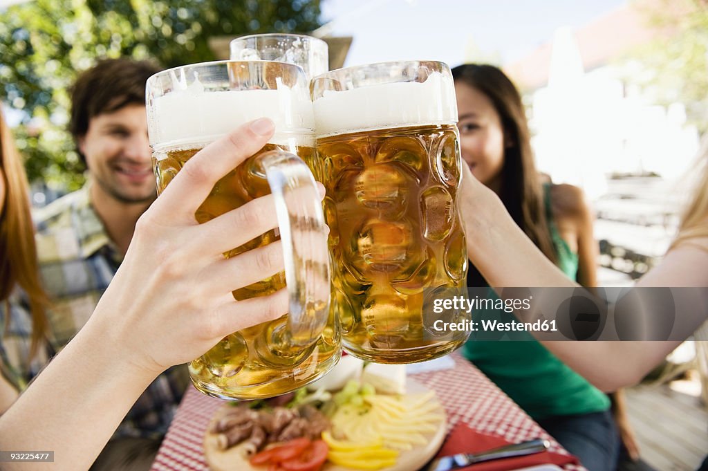Germany, Bavaria, Upper Bavaria, Young people in beer garden, close-up