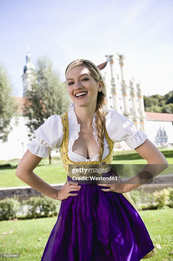 Germany, Bavaria, Upper Bavaria, Young woman in traditional costume, portrait, close-up