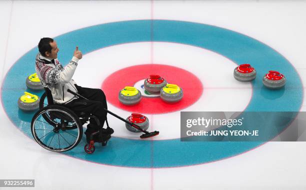 Slovakia's Radoslav Duris gestures during the wheelchair curling round robin session at the Gangneung Curling Centre during the Pyeongchang 2018...