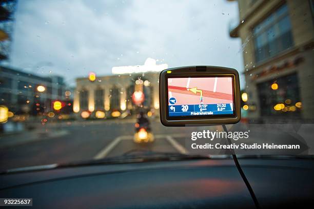 germany, berlin, navigation system in car, traffic seen through windscreen - global positioning system stock pictures, royalty-free photos & images