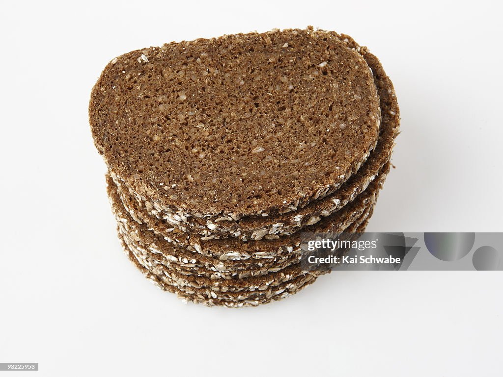 Stacked slices of brown bread, elevated view