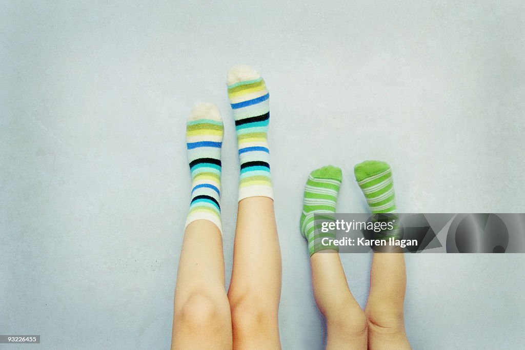 A pair of feet with striped Socks (Mother & Child)