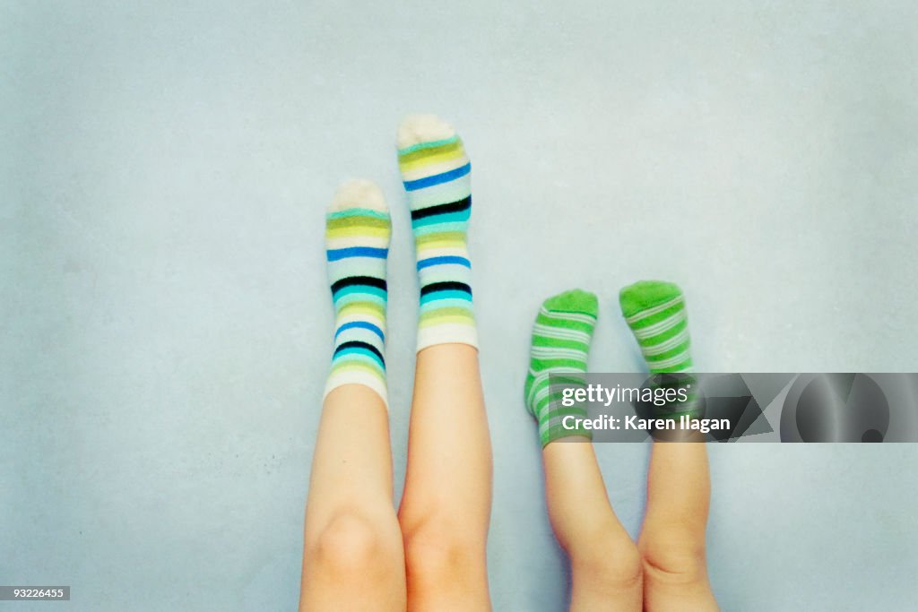 A pair of feet with striped Socks (Mother & Child)