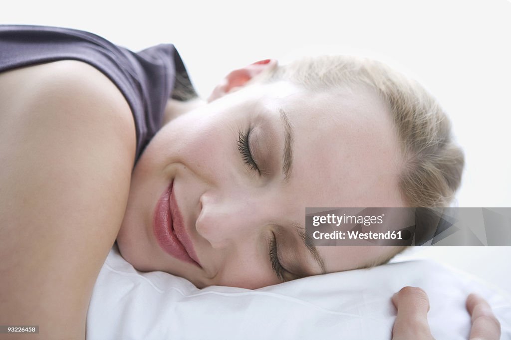 Young woman sleeping, portrait