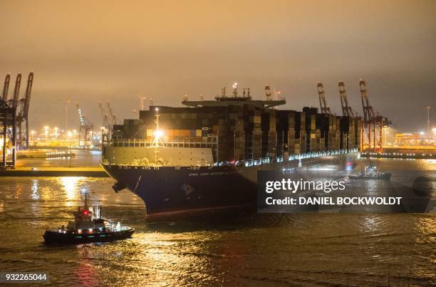 The container ship "Antoine de Saint Exupery" operated by the French CMA CGM shipping company runs into the port of Hamburg, northern Germany, on...