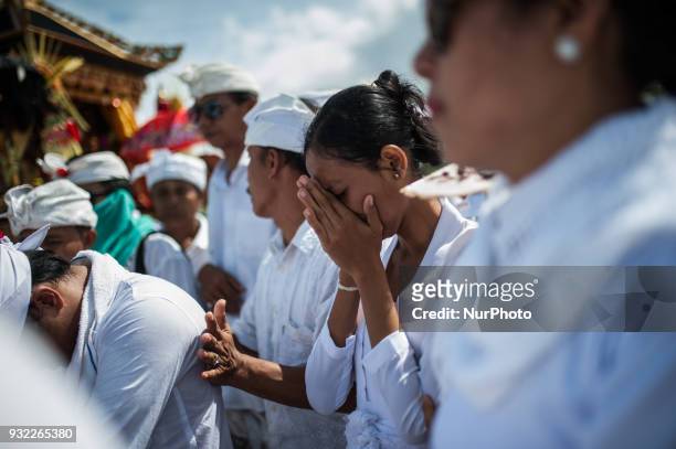 Balinese ritual trance in melasti in Petitenget beach on March 14, 2018 in Bali, Indonesia. The melasti ritual is aimed at self-purification which is...